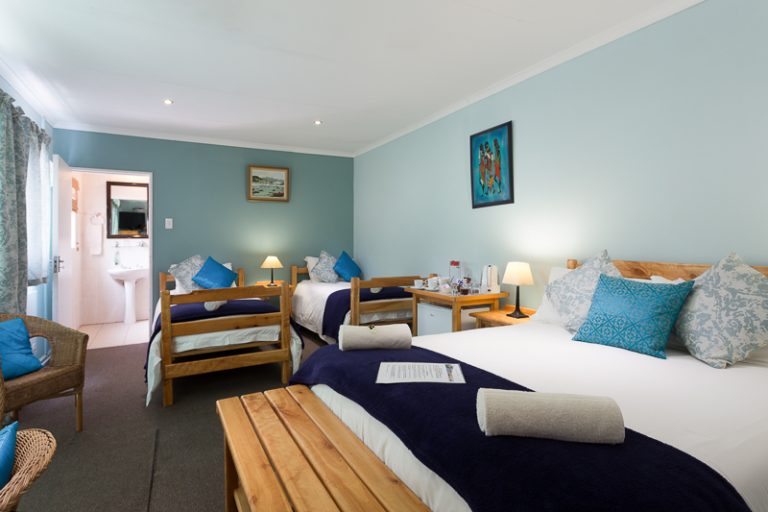 Our spacious Room 6 sleeps 4, with a double bed, 2 singles beds and en-suite bathroom with shower